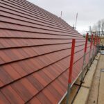 New build red plain tile roof scaffolding West Yorkshire